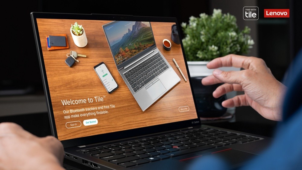 照片中提到了FIND WITH、tile、Lenovo，跟联想有关，包含了笔记本电脑、联想ThinkPad X1 Carbon、消费电子展 2022、电脑